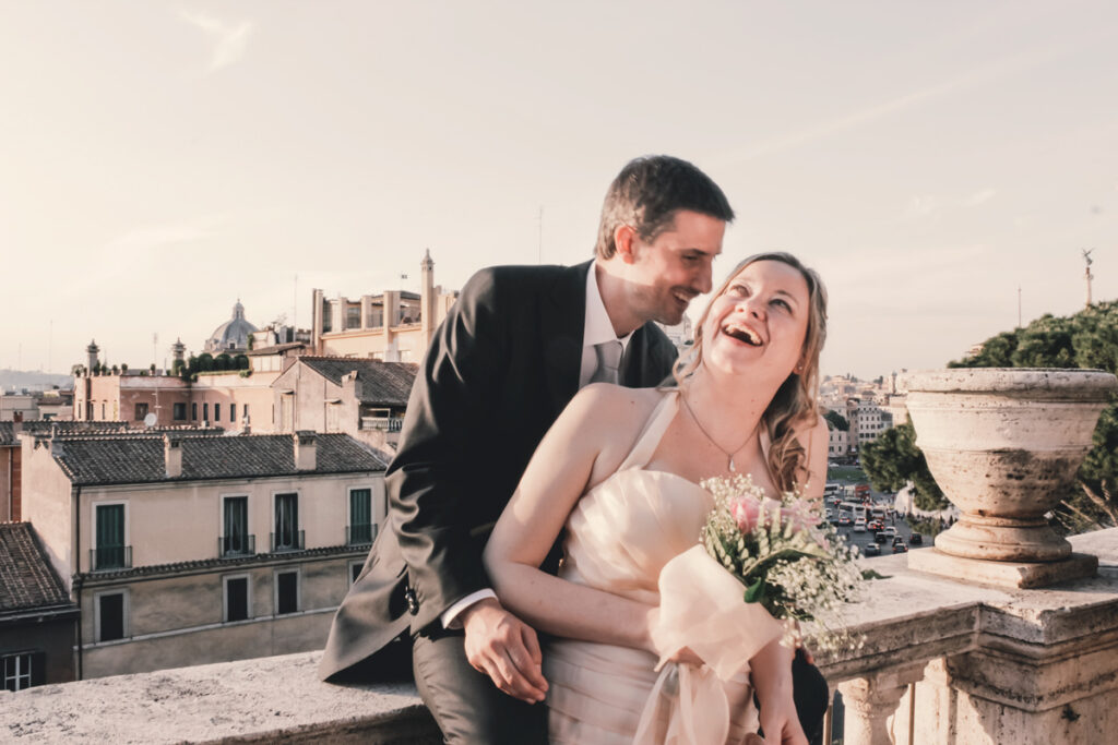 The smiling spouses with the roofs of Rome in the background, Terrazza Caffarelli