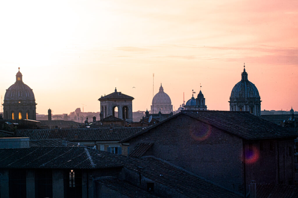 the roofs and domes of rome at sunset from the terrace Caffarelli