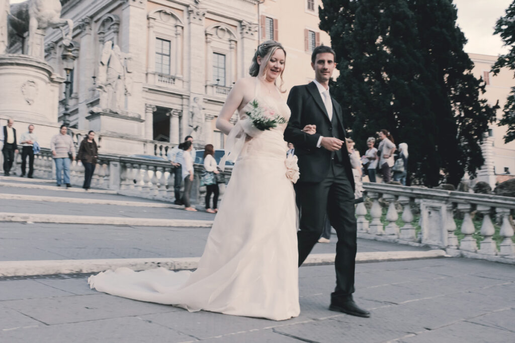 the newlyweds descend the steps of the Capitol in Rome