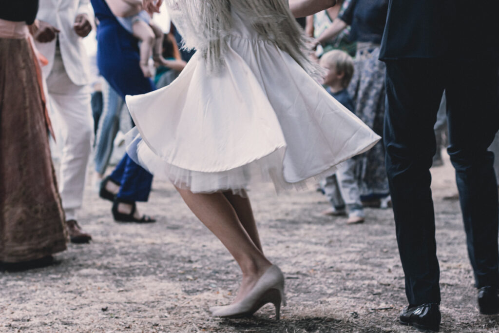 the bride dances, wedding dress and shoes while dancing