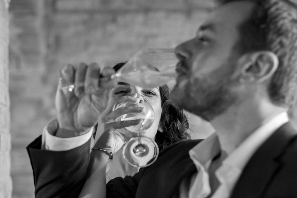 the spouses cross the glasses during the wedding toast