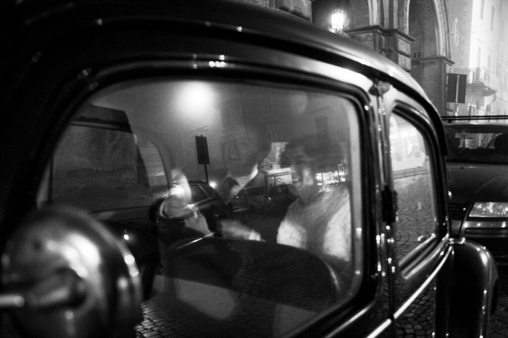 bride and groom inside the vintage car